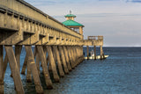 Side View of Long Ocean Pier in Sunlight and Blue Skies, Ready for Fishing