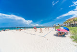 Vibrant Blue Beach at Playtime