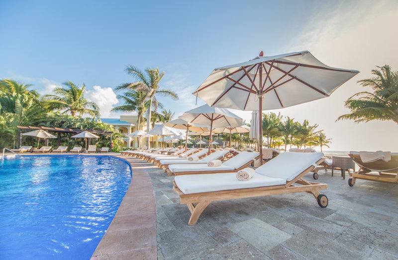 Airy Poolside Beach Chairs and Umbrella's