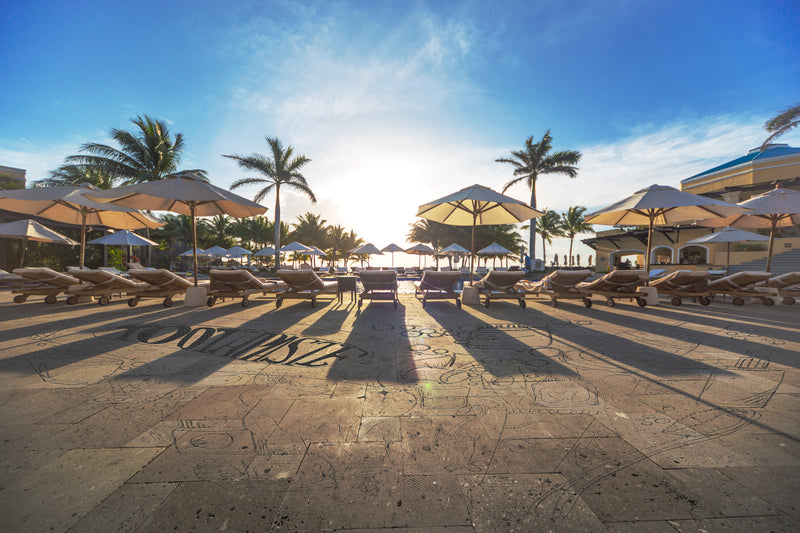 Tropical Paradise Sunrise Over Pool with Dental Mural on Concrete
